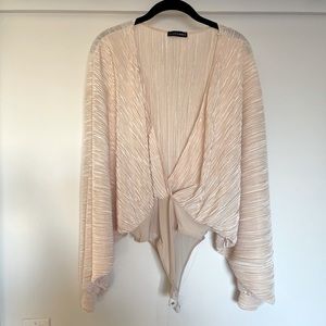 Super sleek and sexy bodysuit. V-slit on top